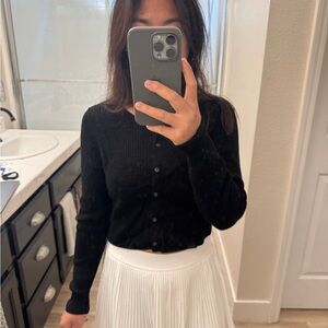 Black Ribbed Cardigan and White Pleated Skirt